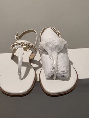 Michael Kors Elegant White T-Strap Sandals with Gold Chain Accent